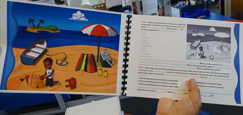 The storybook A Day at the Beach has prompts for teachers to have a 
...