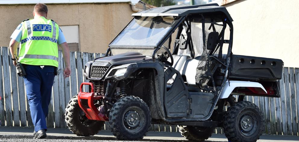 Police inspect the ATV yesterday. Photo: Peter McIntosh