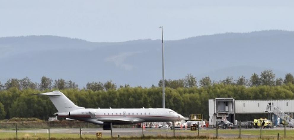 Mystery flight ... A Bombardier Global Express jet sits on the runway at an otherwise all but...