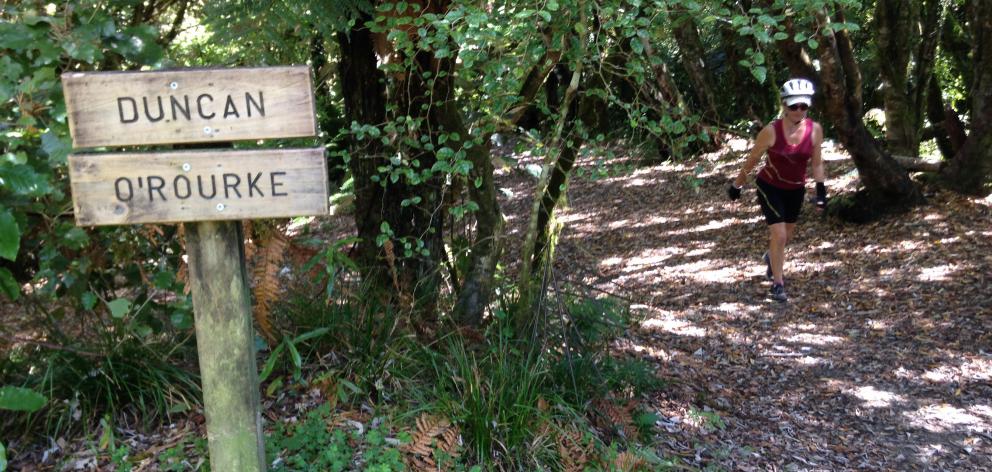 Signboards mark abandoned farms along the trail.