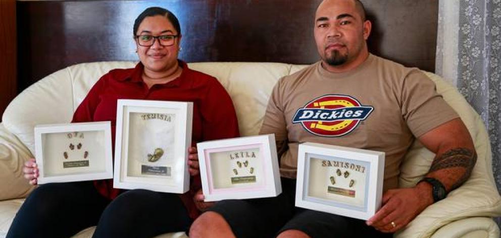 Adi and Ofa Koloamatangi with memories created by Baby Loss NZ for them after their lost their four babies to miscarriage. Photo: NZ Herald