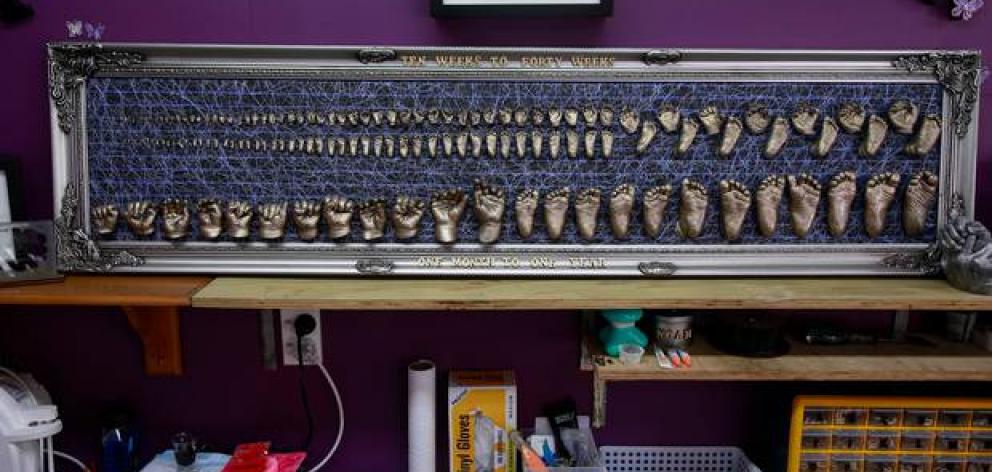Baby Loss NZ has framed copies of casts of hands and feet of babies from 10 weeks to 40 weeks gestation who died. The lower portion is casts of a living child. Photo: NZ Herald