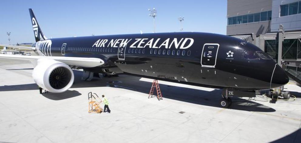 An Air New Zealand 787-9 Dreamliner sits in its stall at the Boeing Delivery Centre in Everett,...
