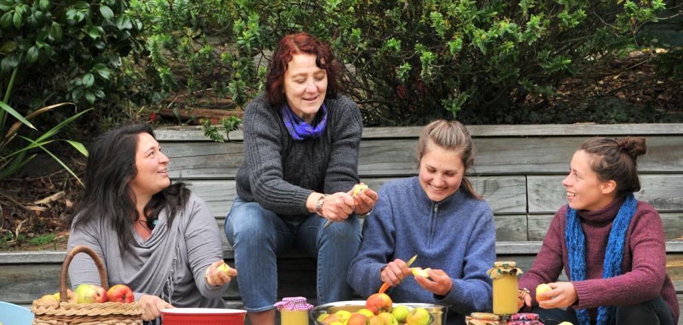 Processing apples for some apple jam and a pie on Saturday are (from left) Lidia Campos (29), Liz...