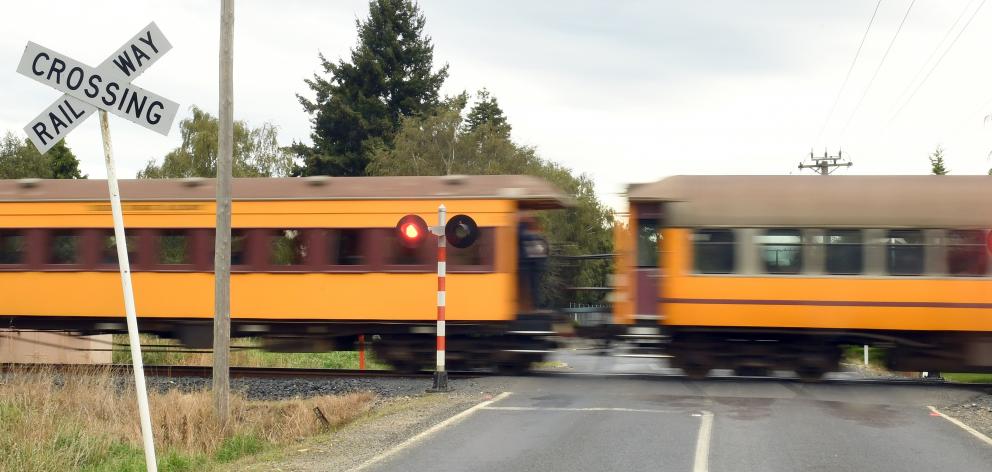 The Taieri Gorge train crosses Dukes Rd. PHOTO: ODT FILES