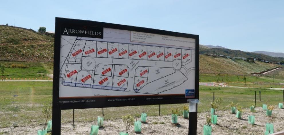 'Sold' signs populate this billboard at Arrowfields. Photo: Mountain Scene