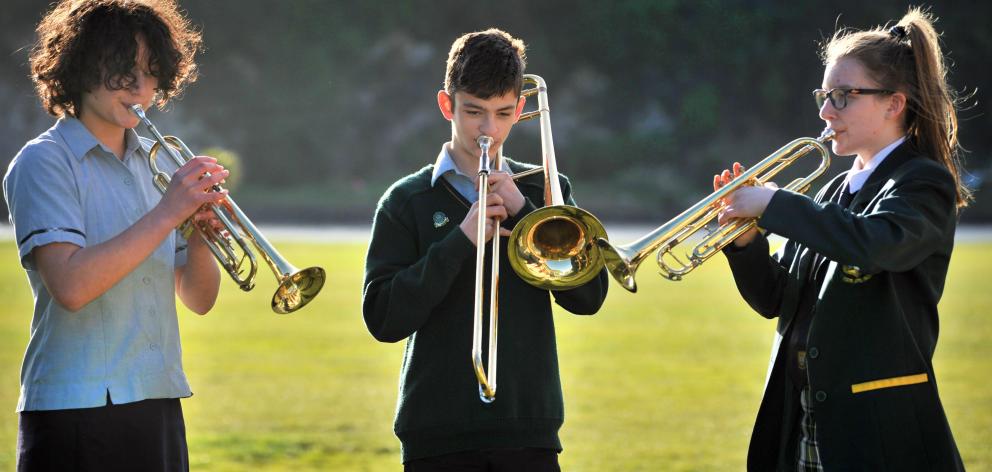 Burnishing the sound ... Bayfield High School brass musicians (from left) Mei Admiraal (14),...