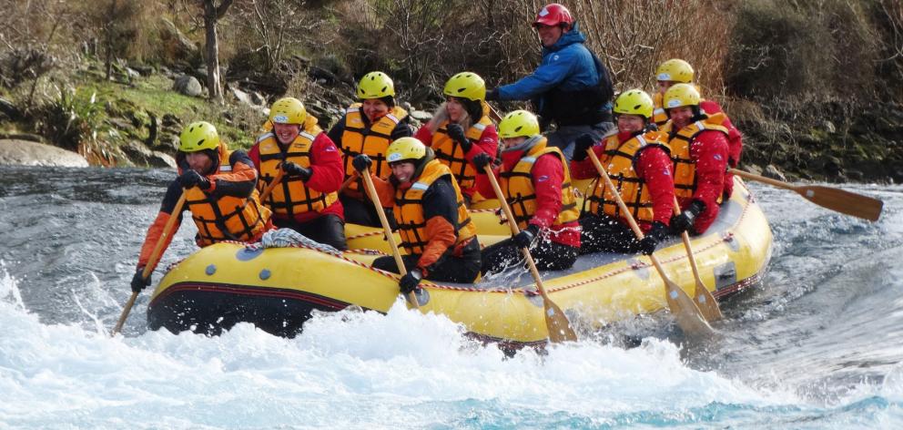 Upper Clutha essential workers plough through ‘‘the wave’’ on the Hawea River. PHOTO: MARK PRICE
