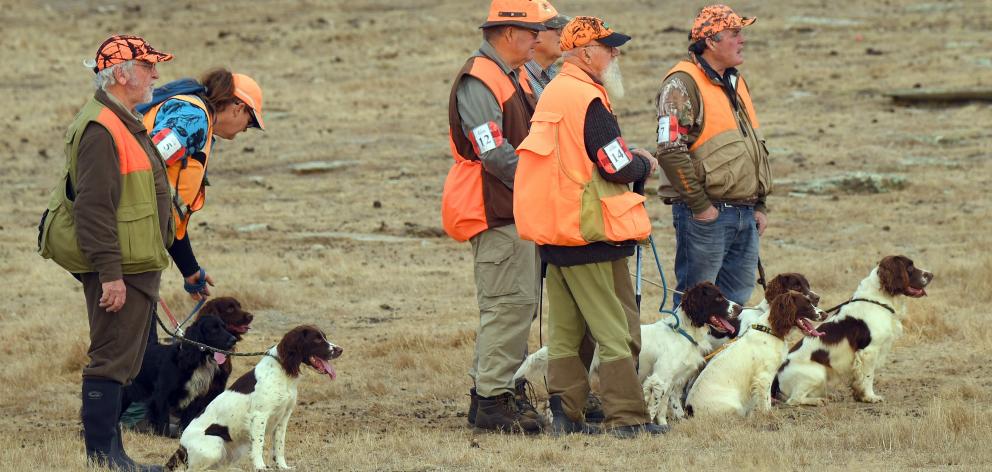 Competitors look on as they wait their turn to compete.