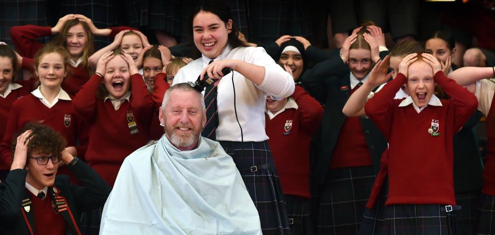 Kaikorai Valley College principal Rick Geerlofs is given a much-needed haircut by head girl...