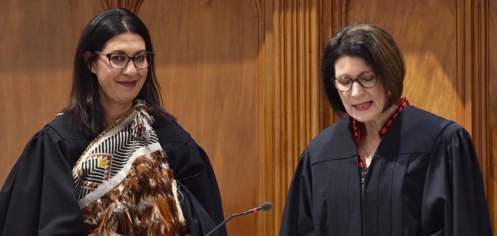 Judge Melinda Broek (left) is sworn in by Judge Jacquelyn Moran during a special sitting of the...