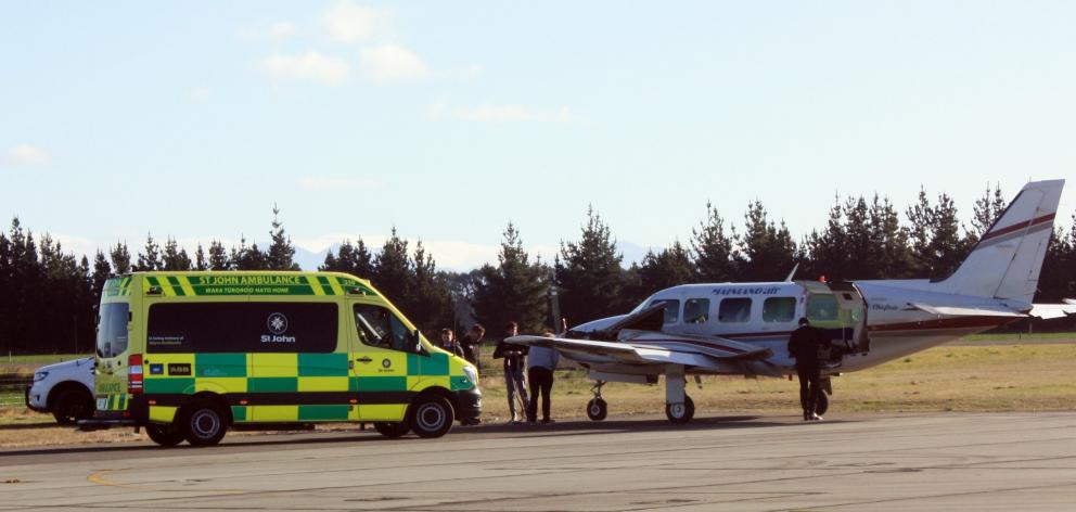 An ambulance was called to take a patient to Dunedin Hospital after the plane they were on was...