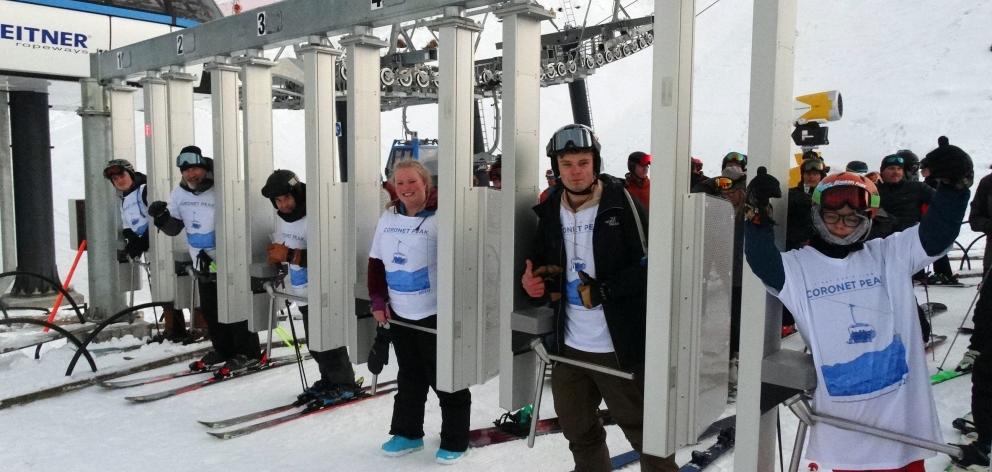 On the first chair at Coronet Peak yesterday are (from left) Roland Cameron, of Invercargill,...