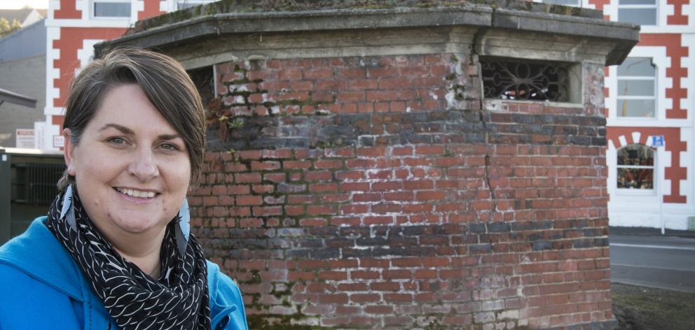 Dunedin City Council digital archivist Alison Breese outside the former public toilet near the...