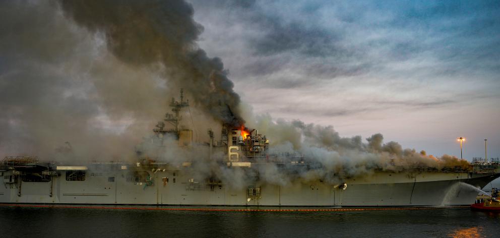 Boats combat a fire on board the US Navy amphibious assault ship USS Bonhomme Richard. Photo: U.S. Navy/Mass Communication Specialist 2nd Class Austin Haist/Handout via Reuters Boats combat a fire on board the US Navy amphibious assault ship USS Bonhomme Richard. Photo: U.S. Navy/Mass Communication Specialist 2nd Class Austin Haist/Handout via Reuters