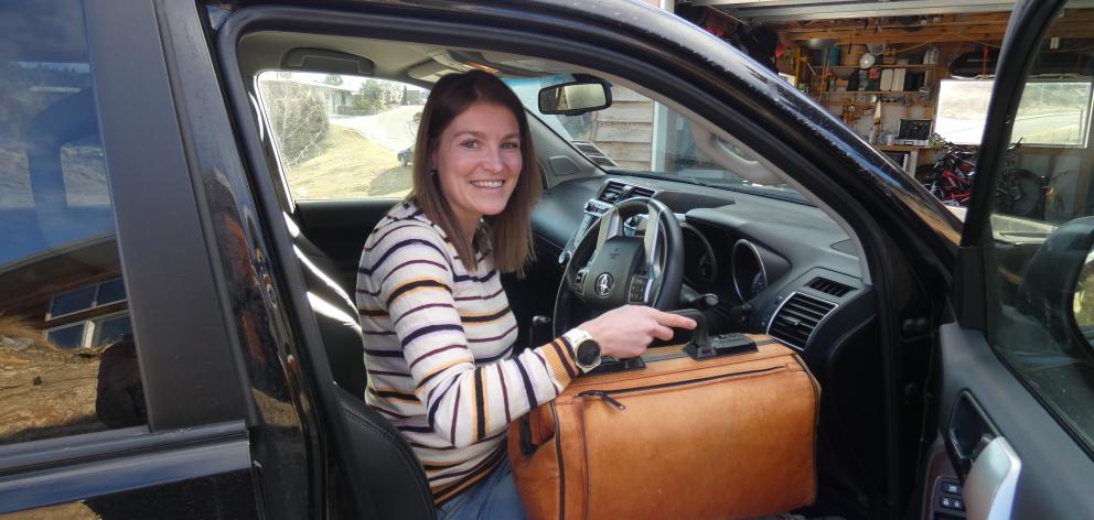 Mrs Aarden with her midwifery bag gets ready to hit the road.