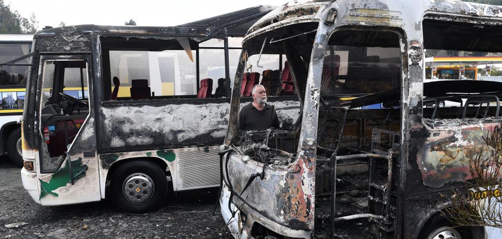 Good Company Tours owner and operator Richard Trainor looks at the damage done after two of his...