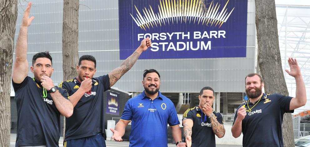 Otago Rugby Referees Association education officer Tumua Ioane (centre) is surrounded by...