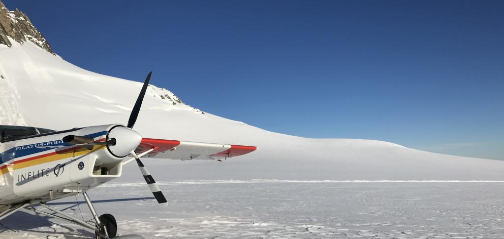 The ski plane lands on the Geikie Snowfield of Franz Josef  Glacier.