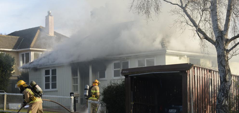 Smoke billows from a house fire in Middleton Rd, Dunedin. Photo: Gerard O'Brien Smoke billows from a house fire in Middleton Rd, Dunedin. Photo: Gerard O'Brien