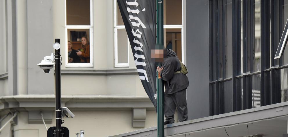 Police rushed to lower Stuart St yesterday morning after a man allegedly smashed windows and...