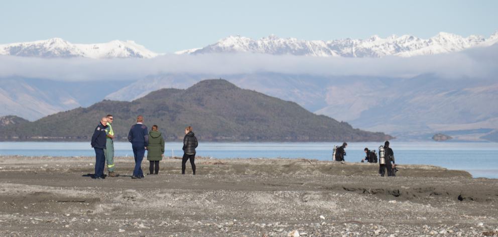 Police, search and rescue teams and members of the national police dive squad search the Lake...