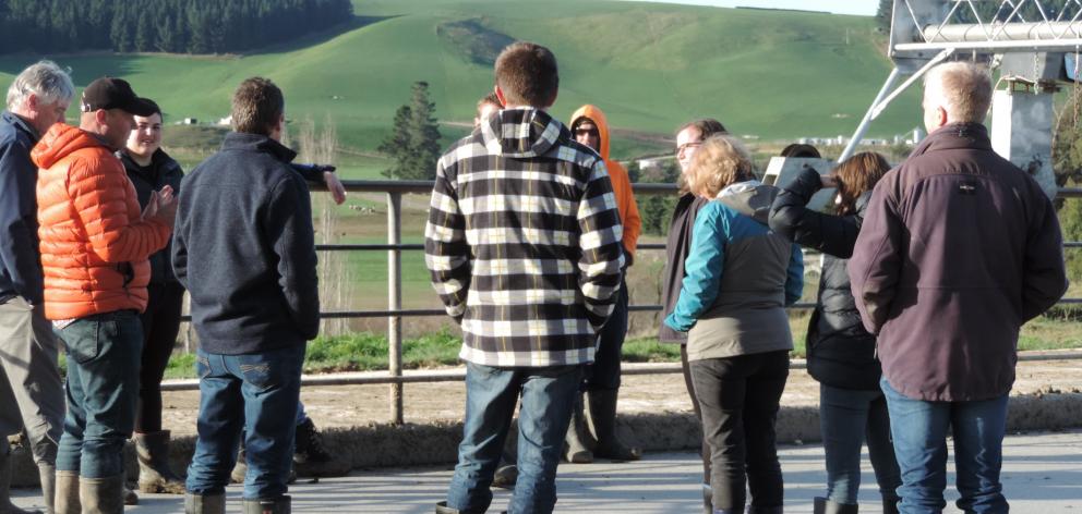 Lyndon Strang (left, in orange jacket) tells Otago Regional Council staff how the dairy farm’s...