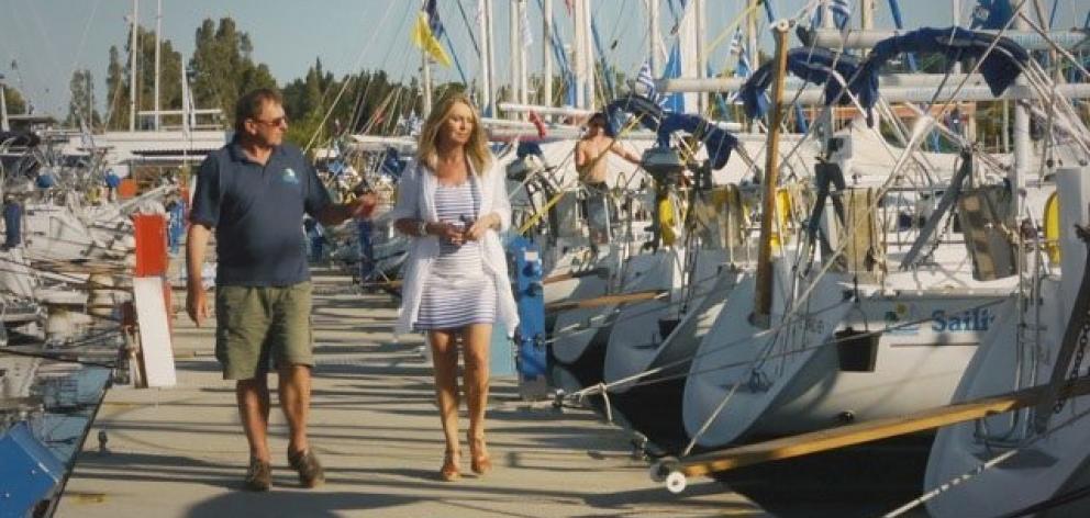 Former Dunedin man Barrie Neilson shows Hilary Timmins some of his flotilla of yachts at berth in...