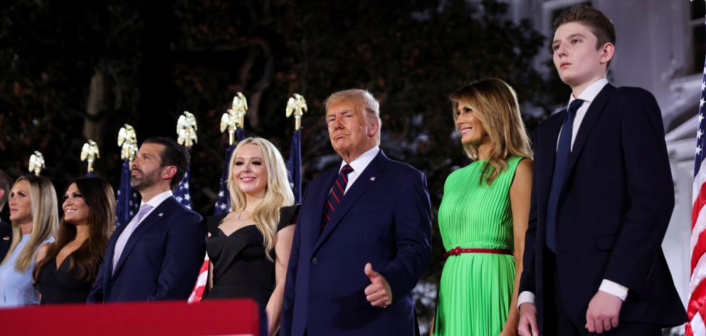 U.S. President Donald Trump gives a thumbs-ups next to first lady Melania Trump and their extended family after accepting the Republican presidential nomination during the final event of the Republican National Convention. Photo: Reuters