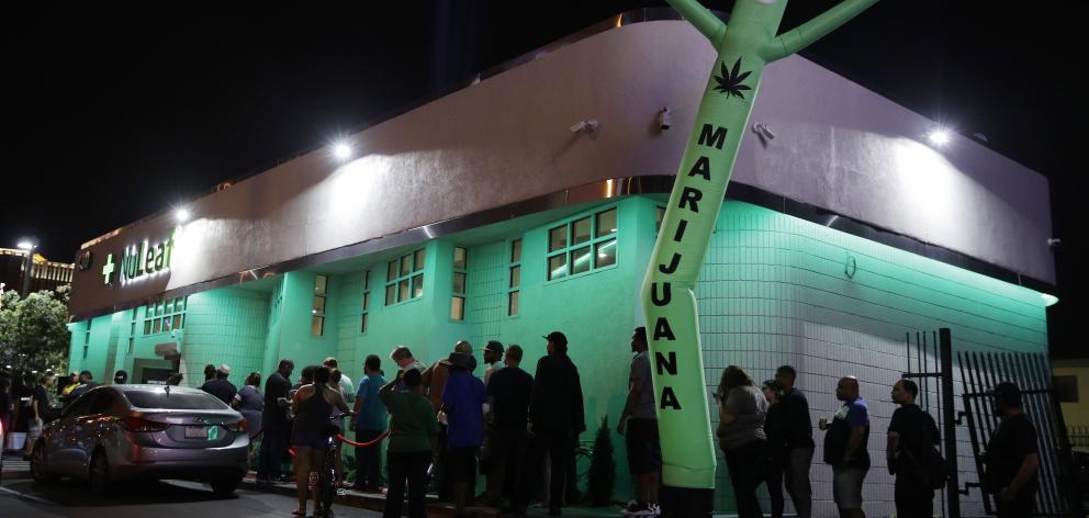 Recreational cannabis users line up at a marijuana dispensary in Las Vegas. Multiple states in...