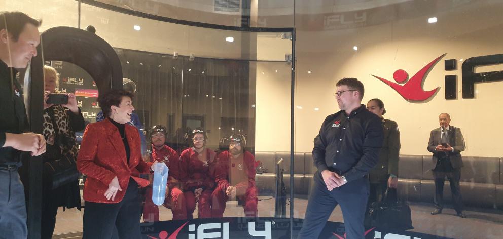 iFly sales and marketing manager Jason Williams (right) shows New Zealand Governor-General Dame...