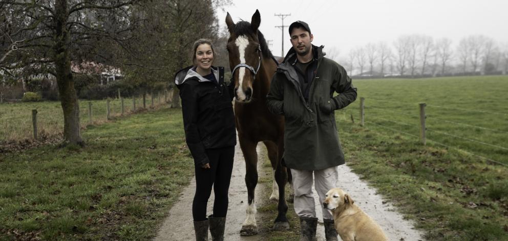 Dairy farm manager Carol Booth, pictured with partner Gordon Preedy, horse Legacy and Weasel the...