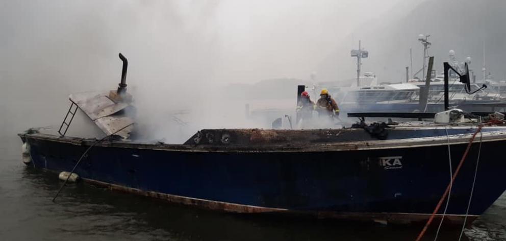 Firefighters were forced to fight the blaze from the wharf due to the safety risk posed by the...