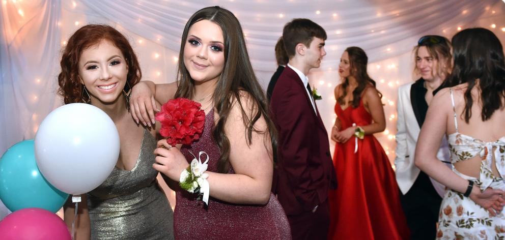 Annabelle Ring (left) and Paige Carey (both 16) were all glammed up and ready to dance the night...