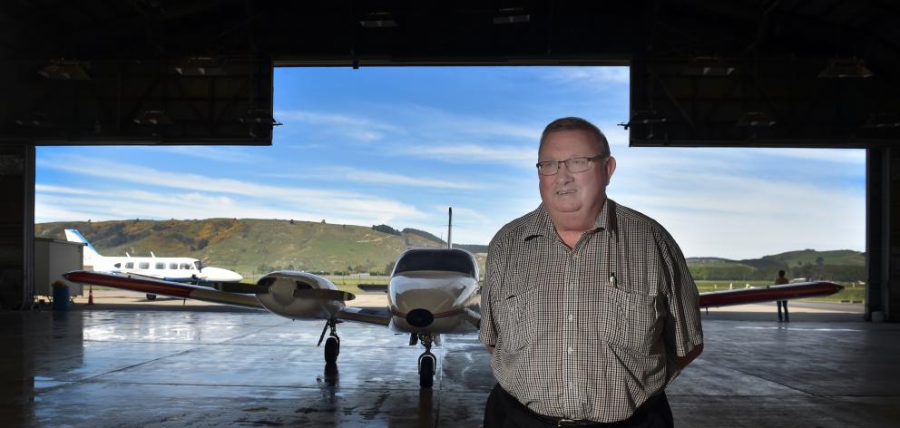 Mainland Air owner Phil Kean with one of the flight school’s planes in the hanger at Dunedin...