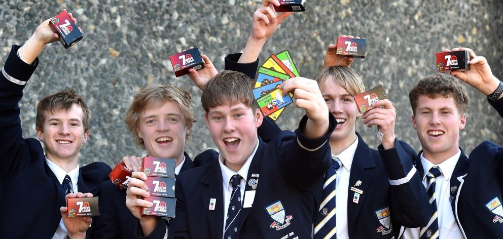 Five of the seven Otago Boys’ High School pupils who created a Maori card game that has hit store...