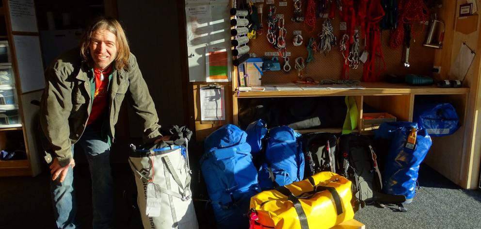 Wanaka volunteer SAR Alpine rescue team member Davie Robinson arranging the pre-packed gear for...