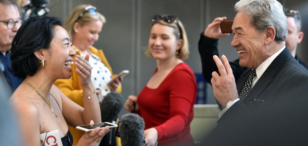 New Zealand First leader Winston Peters speaks with Naomii Seah at the University of Otago during...