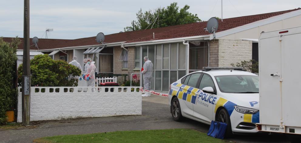 Police stand by as a scene examination is carried out on a Grace St property in Invercargill...