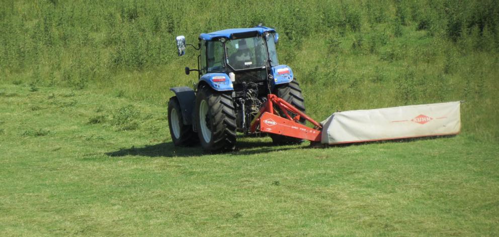 It has been dry enough in the past week or so to allow this tractor operator the opportunity to mow a paddock on the Raes Junction-Crookston Road. Photo: Yvonne O'Hara