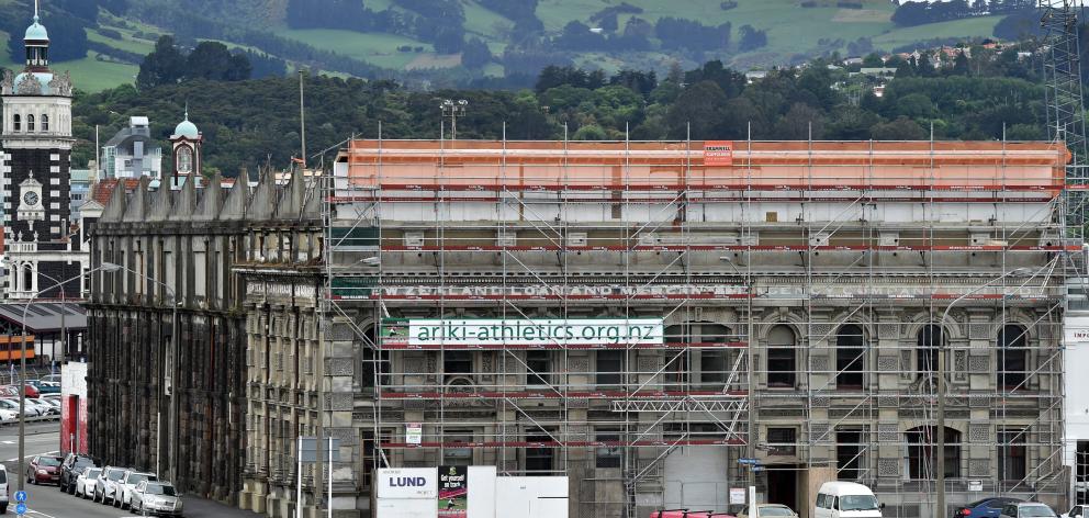 Scaffolding surrounds the Loan and Mercantile building on Tuesday. PHOTO: PETER MCINTOSH