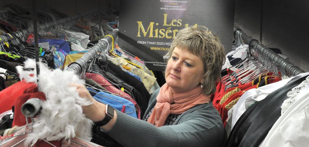 Musical Theatre Dunedin wardrobe manager June Driver dusts off costumes for the theatre company’s...