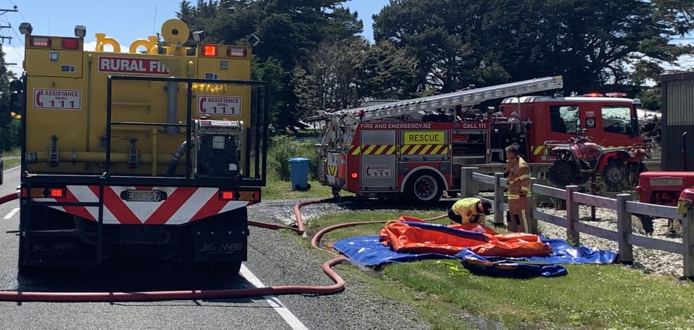 Fire crews at the scene of the blaze near Otatara. Photo: Abbey Palmer