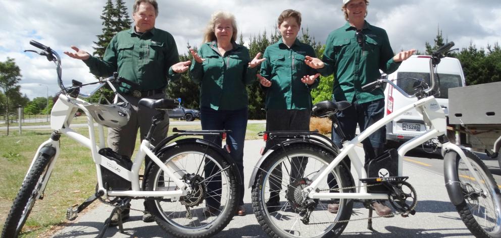 At the Lake Wanaka lakefront with two of their 80 e-bikes are (from left) Rik, Juliet, Bayne (14)...