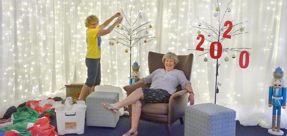 Ali Jarvis (left) and Yeverley McCarthy prepare Santa's Grotto for his arrival at the Wanaka...