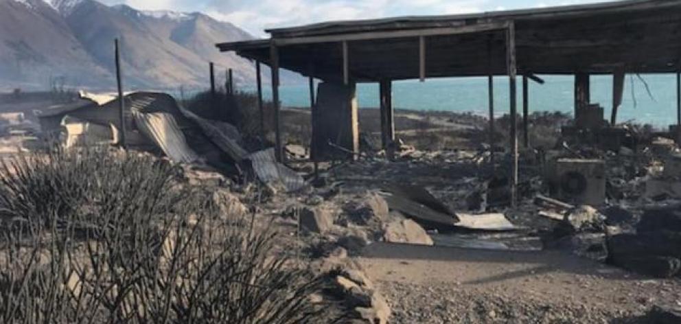 A fire-ravaged remains of a house near the shore of Lake Ohau. Photo: Supplied