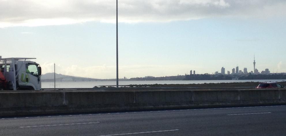 Rangitoto and the Auckland CBD from the North-Western Motorway. PHOTOS: ELEANOR HUGHES