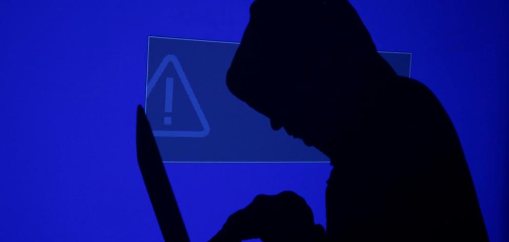 Cyber extortionists tricked victims into opening malicious malware attachments. Photo Reuters 