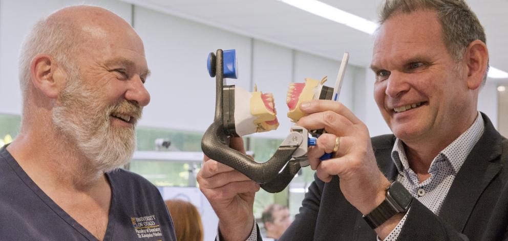 Dental School production laboratory technical services manager Steve Swindells (left) and oral...