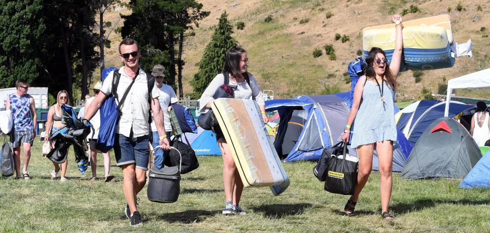 Friends Steele Bartlett, Alex Roach and Katie Mead, from Nelson, arrive at Rhythm and Alps in the...